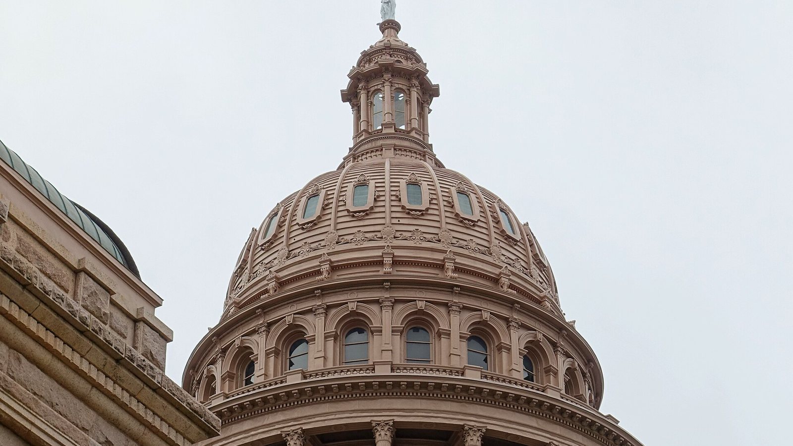 The Texas State Capitol in Austin under a clear sky